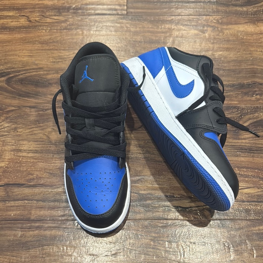 Nike Air Jordan’s big Kids Black, White, and Blue Sneakers